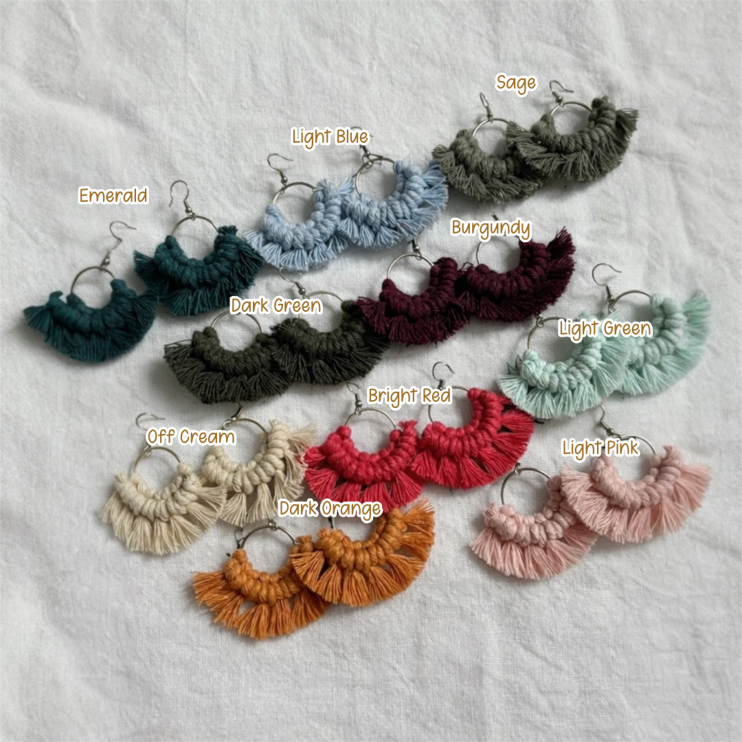 Macrame earrings in various colors on a textured surface